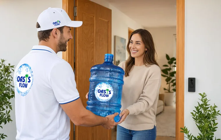 Oasis Flow driver handing a 5 gallon water bottle to a customer at her home in Abu Dhabi